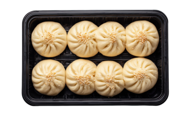 A black plastic container holding eight light golden-brown steamed buns.  Each bun has a slightly domed top sprinkled with sesame seeds