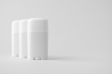 White plastic deodorant or balm stick mockup on neutral background