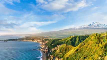 scenic view from above to a beautiful coast with mediterranean touristic town with sea gulf and...