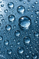Macro Water Droplets on Blue Surface with Reflections and Shallow Depth of Field