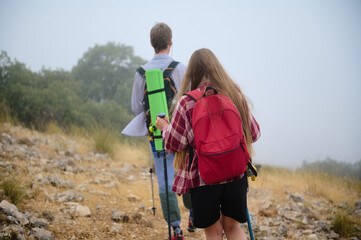 Two Hikers Enjoy Outdoor Adventure in a Scenic Mountain Landscape