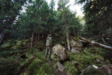 Extreme Wide Shot of Hiker in Dense Carpathian Forest