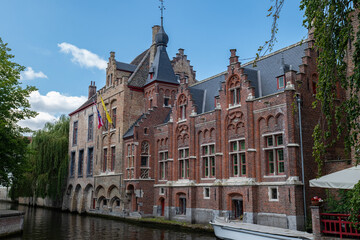 With its canal views, arched windows, and national flags, this classic brick building reflects the...