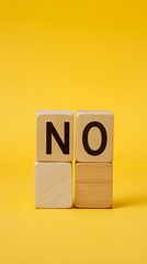 Wooden Blocks Spelling 'NO' on Yellow Backdrop Negative Response, Decline, Refusal