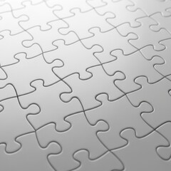 Close up of a blank white jigsaw puzzle pieces arranged in a grid grey
