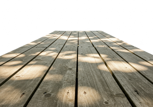 A perspective view of a weathered wooden plank deck with dappled sunlight and shadows isolated on transparent background