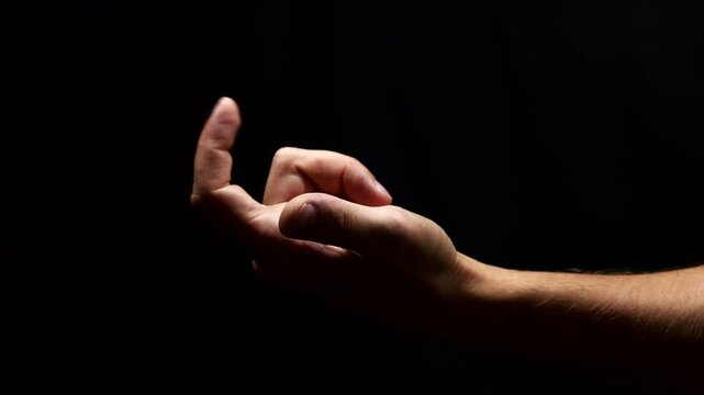 The hand of an adult beckoning him to come to him.
The person offers to follow him and invites him to go somewhere.
Come to me hand gesture on black isolated background