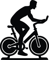 Obraz premium Man riding stationary exercise bicycle for cardio workout