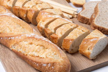 Assortment of Bread Products on white marble background
