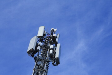 Mobile cell mast or pole. Blue sky. 