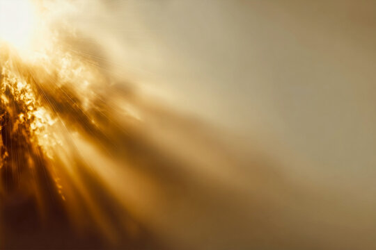 Sunlight streams through clouds, creating a golden glow. Scenic, abstract image for backgrounds, design, or inspirational content.