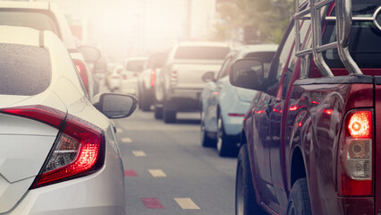 Abstract rear side of cars on the road. Turn on brake light. Traffic in the business time. 