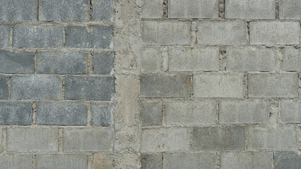 Brick blocks arranged in rows to build a wall. There is a concrete core to strengthen the...