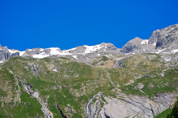 Mountain landscape at L&ouml;tschental Valley with rock and mountain peak in the Swiss Alps on a sunny late spring day. Photo taken June 19th, 2025, L&ouml;tschental, Switzerland.