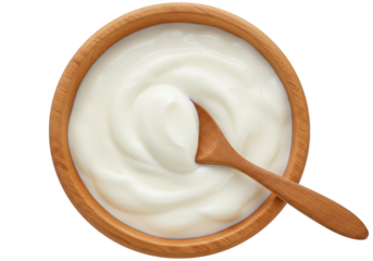 A topdown view of a wooden bowl filled with creamy white yogurt and a wooden spoon, isolated on a transparent background