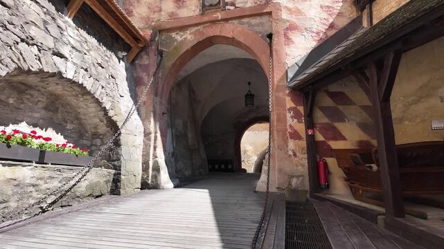Bascule bridge on Medieval Orawski castle Oravský hrad aerie Slovakia fortress with white stone walls and courtyard during a beautiful day