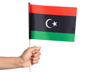 Hand Holding Libya Mini Flag on Stick, Front View with Flag Tilt, Isolated PNG.