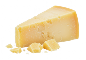 A wedge of aged parmesan cheese with small cubes and crumbs, isolated on a transparent background