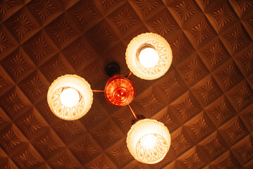 Old soviet chandelier on the ceiling