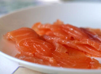 Fresh Sliced Salmon - Detailed Close-up of Thinly Sliced Fresh Orange Smoked Salmon