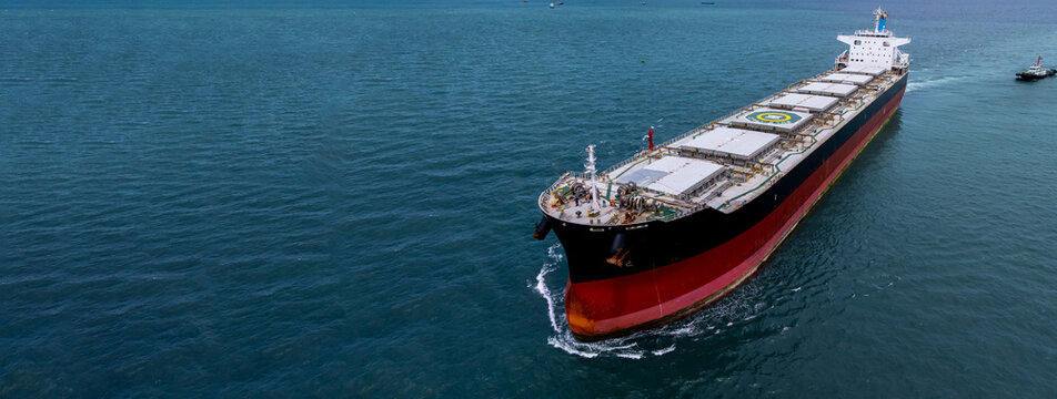 Aerial view bulk carrier cargo ship vessel global business logistic import export industry, Bulk carrier cargo ship vessel dry general cargo vessel underway on sea to port.