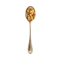 Golden oat flakes in a vintage spoon