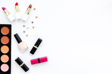 Flatlay of makeup cosmetics on white background. Blusher, mascara and lipstick, top view