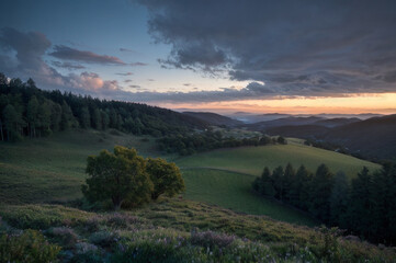 Cloud-draped hillside in after sunset