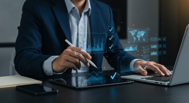 Businessman analyzing digital data on tablet and laptop with holographic interface