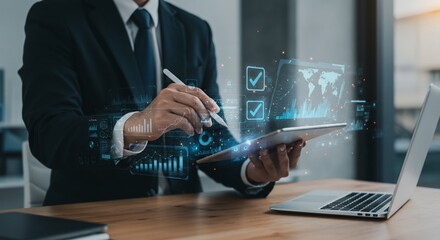 Businessman analyzing global data with digital tablet and pen, futuristic interface