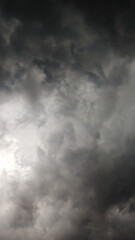 Dark storm clouds gathering in the sky, creating a dramatic and moody atmosphere before a thunderstorm.