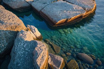 Rocky shoreline in during sunset