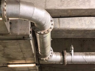 Industrial Metal Pipes Under Concrete Ceiling Structure