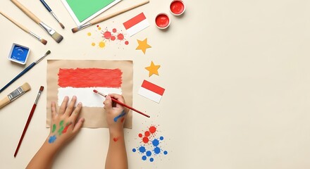 Child painting Indonesian flag with art supplies and creative splashes on beige background.