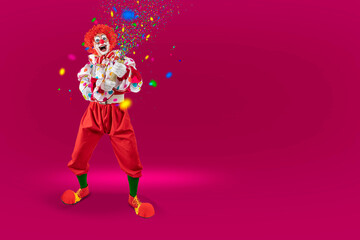 Funny clown pulling carnival cracker. Entertainer Joker in colorful suit and wig.Trickster, jester,...