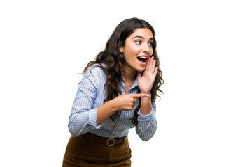 A young woman in a blue striped shirt leans forward, pointing and whispering with her hand cupped around her mouth, isolated on a transparent background