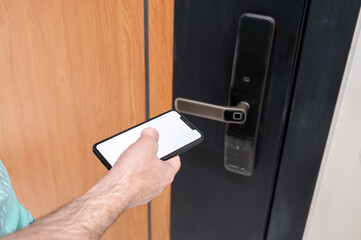 Smart home access with digital lock and smartphone showing white screen, concept of modern secure...