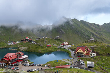 Balea Lake and mountain lodge in the Fagaras Mountains, Romania. Cloudy summer day in the...