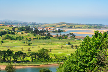 Green and mountainous landscape of the northern coast of Spain in the community of Santander.