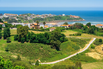 North coast of the community of Cantabria with the town of Suances on a sunny summer day.