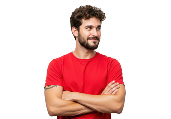 A man with curly hair and a beard in a red tshirt stands with his arms crossed, looking away, isolated on a transparent background