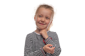 Portrait of a little girl with a playful smile wearing a striped shirt, posing with her hand on her...