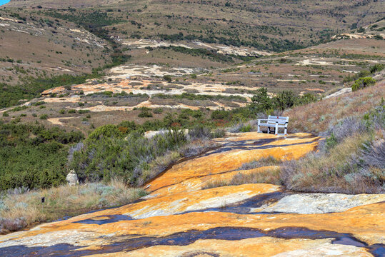 Bench on Clarens Porcupine Trail. Orange sandstone is visible