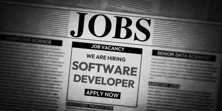 Hiring Software Developer concept with main heading and typography showing in the newspaper.
