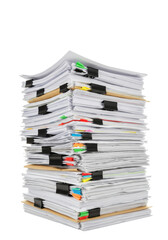 A towering, precariously balanced, disorganized stack of creased white paper documents, formal files, and manila folders with black binder clips and colored tab dividers against a transparent studio