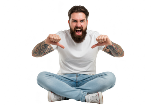 An angry man with a beard and tattoos, wearing a white tshirt and light blue jeans, sitting crosslegged with thumbs down, showing a negative emotion isolated on a transparent background