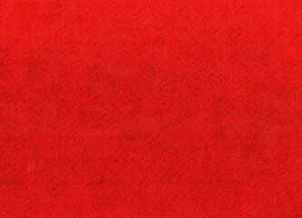 Fototapeta premium Red felt fabric close-up for a Christmas textile texture background, backdrop stock photo image