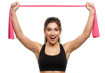 A fit woman with a joyful expression holds a pink resistance band overhead, isolated on a transparent background