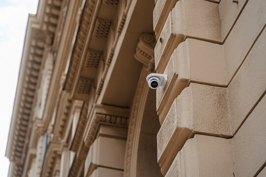 Surveillance camera on historic building facade
