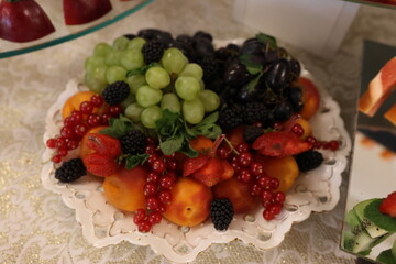 The festive fruit table is beautifully decorated.